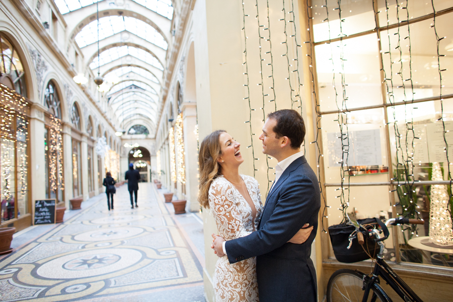 Couple in a beautiful covered parisian gallery. Photo illustrating a blog post about 5 nice places around Paris for a family or engagement photo session.