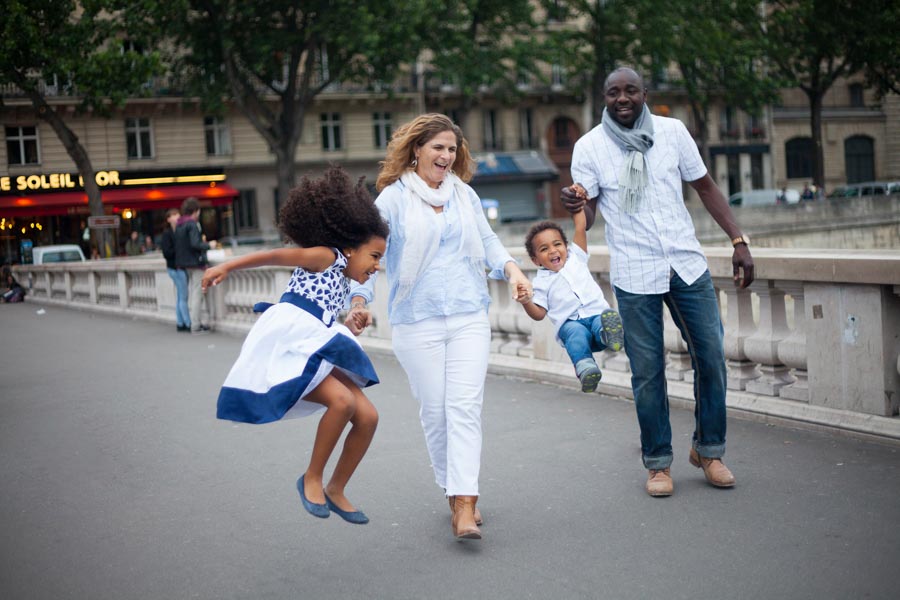 A family of four people. Captured by Bulles de Joie, Paris family photographer.