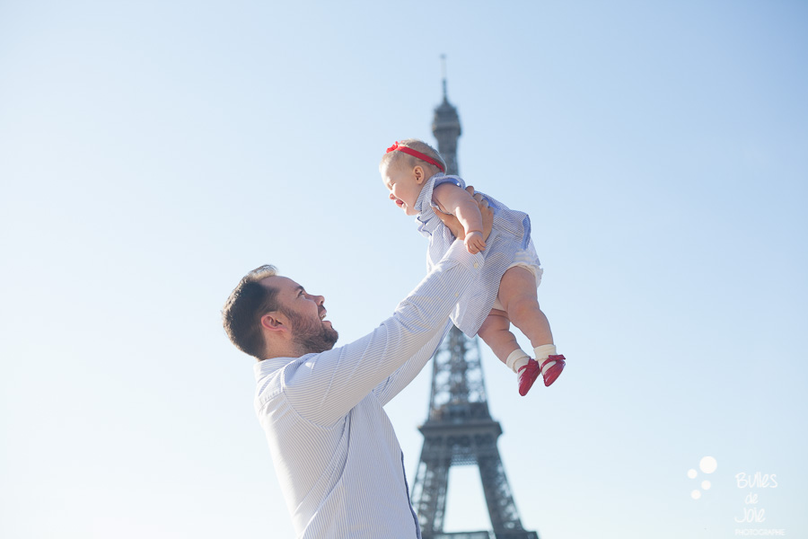 Paris family photoshoot with a toddler of 9-month years old in front of the Eiffel Tower - professional photographer: Bulles de Joie. More photos: