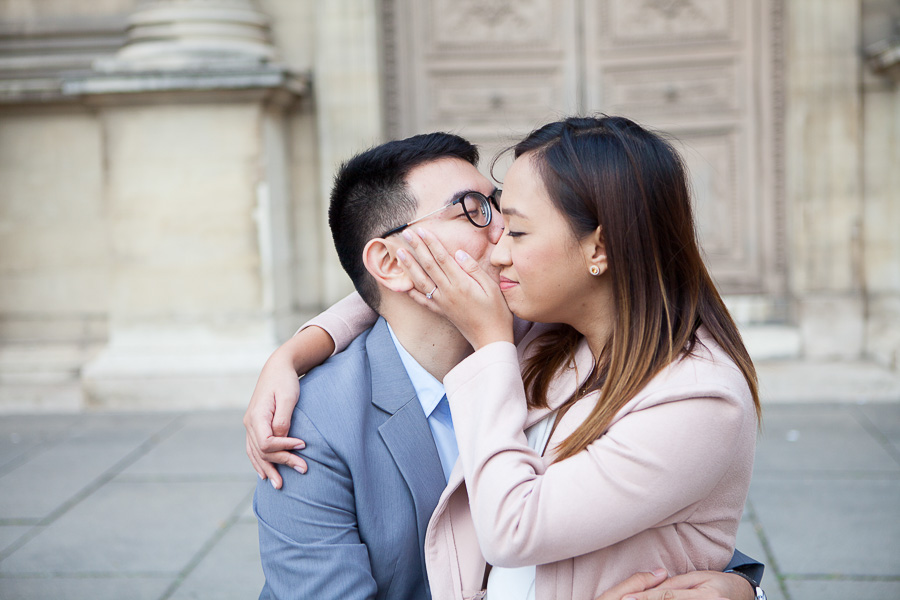 Couple kissing at the Louvre, Paris