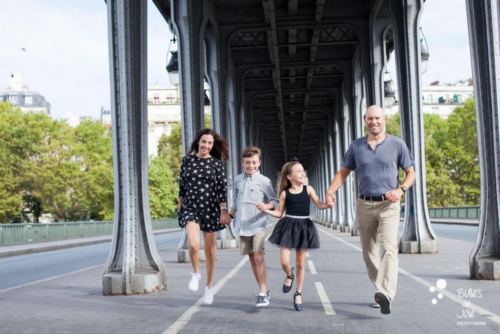 Family photoshoot at Bir Hakeim Bridge, Paris candid family shots