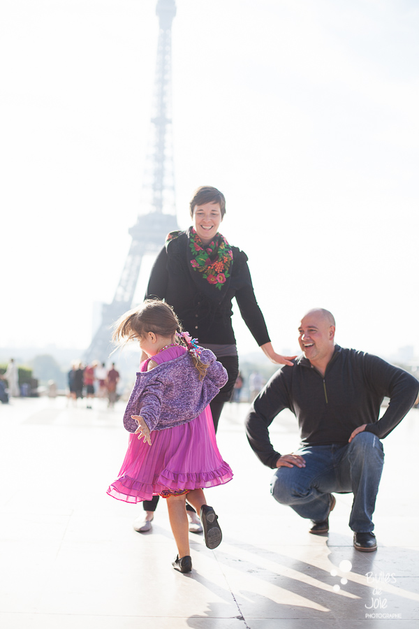 Candid family photoshoot in Paris with the Eiffel Tower in the background