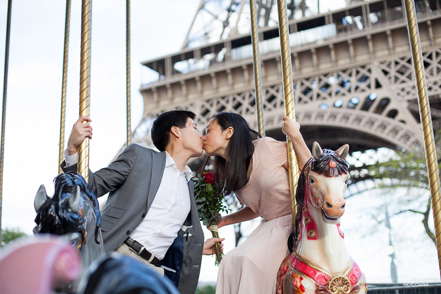 Romantic love photo session in Paris - carrousel with the Eiffel Tower in the background